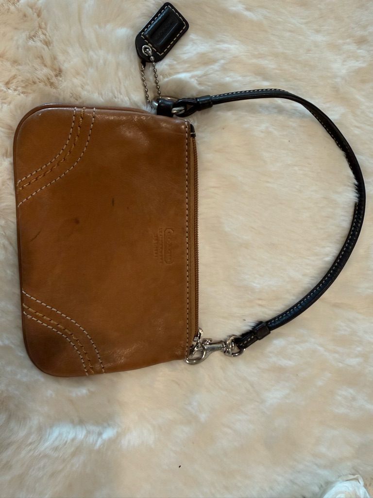 Coach Tan Leather Wristlet With Black Strap , It's Staine In Some Places